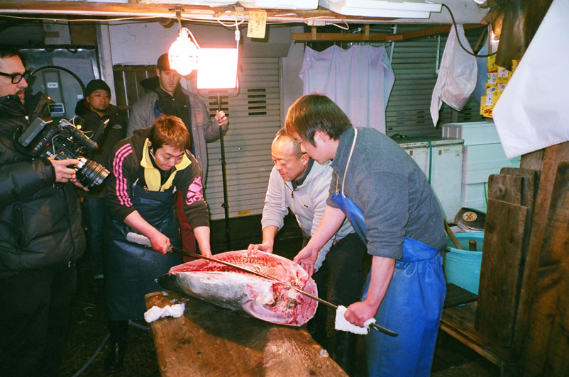 The Shibuya fisherman carefully carving up a 100-pound tuna in the traditional blessing of the restaurant. After the boys attempted to cut up their share of the catch, the tuna had to be discarded into the bin and they were told to practice their filleting skills. Later the boys dug into some fresh sashimi – it felt like ice cream melting into their stomachs.
